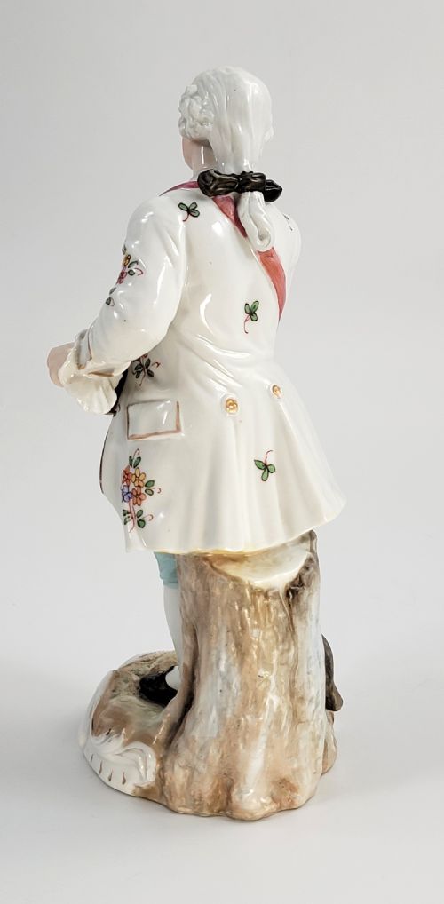 fig 2. A Samson of Paris porcelain figure depicting an eighteenth-century male musician holding a hurdy-gurdy, decorated with hand-painted floral motifs and gilding.