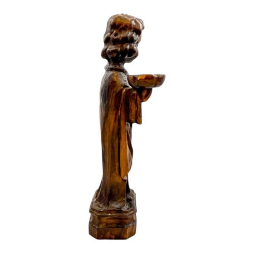 fig 1. An 18th-century Continental carved wooden figure of an acolyte in draped robes holding a small dish, mounted on a square plinth.