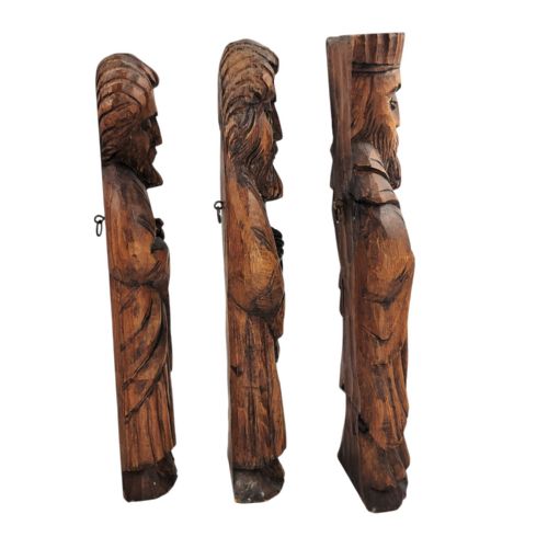 fig 1. A set of five hand-carved warm brown wooden figures depicting bearded religious characters in robes with distinct facial expressions and headwear.