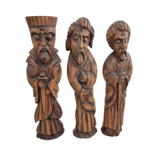 fig 2. A set of five hand-carved warm brown wooden figures depicting bearded religious characters in robes with distinct facial expressions and headwear.