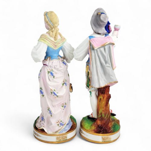 fig 2. A pair of nineteenth-century French porcelain figurines depicting a man raising a glass and a woman playing a lute, dressed in pastel polychrome attire on gilded bases.