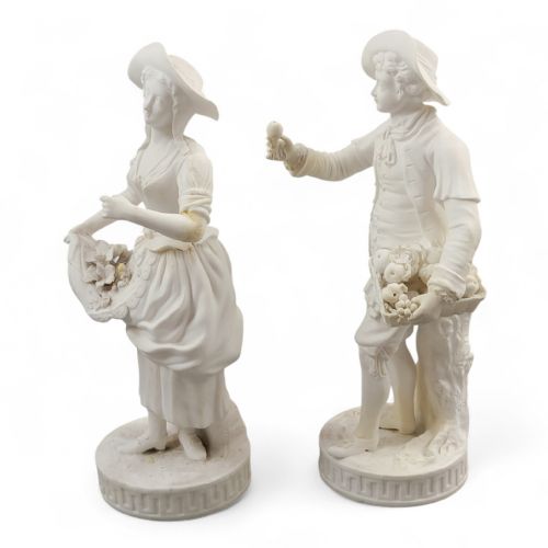 fig 1. A pair of white unglazed Parian porcelain figurines depicting a male and female gardener wearing 18th-century style attire on Greek key bases.