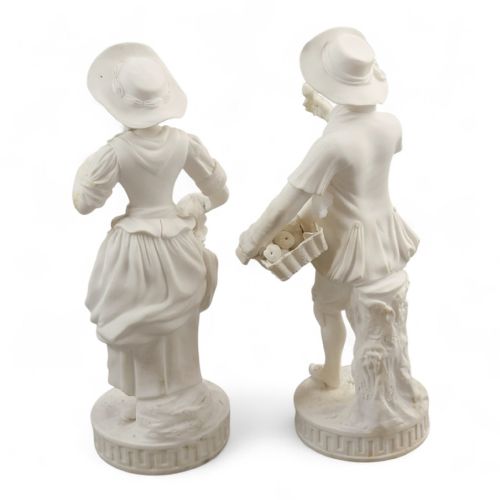 fig 2. A pair of white unglazed Parian porcelain figurines depicting a male and female gardener wearing 18th-century style attire on Greek key bases.