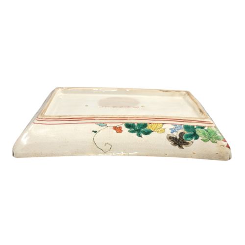 fig 4. A rectangular Japanese Kutani porcelain platter decorated with polychrome peony blossoms and green leaves over a textured gold background, framed by a floral border.