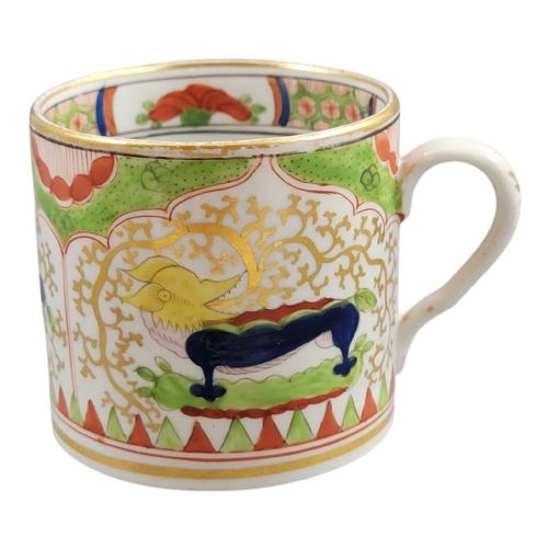fig 1. An antique Worcester porcelain coffee cup and deep saucer decorated with hand-painted Chinoiserie dragon motifs in green, red, yellow, and blue with gilded accents.