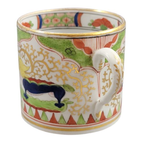 fig 2. An antique Worcester porcelain coffee cup and deep saucer decorated with hand-painted Chinoiserie dragon motifs in green, red, yellow, and blue with gilded accents.