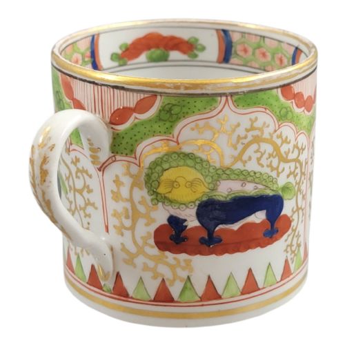 fig 3. An antique Worcester porcelain coffee cup and deep saucer decorated with hand-painted Chinoiserie dragon motifs in green, red, yellow, and blue with gilded accents.