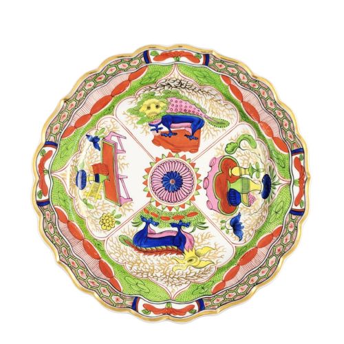 fig 3. A circular Regency porcelain plate with a scalloped gilded rim and hand-painted dragon in compartments pattern in red, green, and blue enamels.