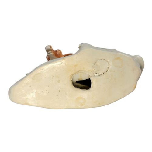 fig 5. A pair of 18th-century Derby porcelain figures depicting a reclining stag with branched antlers and a doe, painted with chestnut-spotted coats on floral-adorned white bases.
