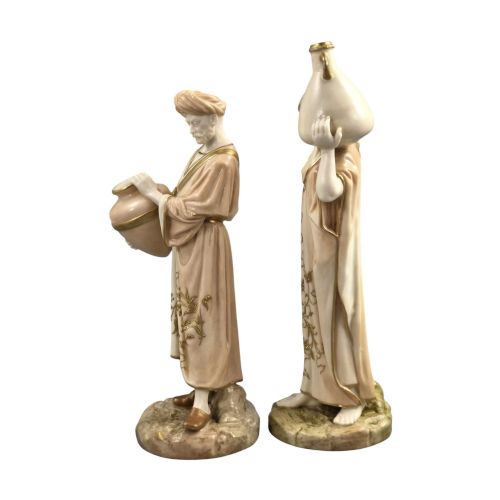 fig 1. A pair of Royal Worcester blush ivory porcelain figures depicting a male and female Cairo water carrier with gilded accents.