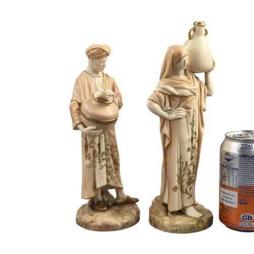 fig 4. A pair of Royal Worcester blush ivory porcelain figures depicting a male and female Cairo water carrier with gilded accents.