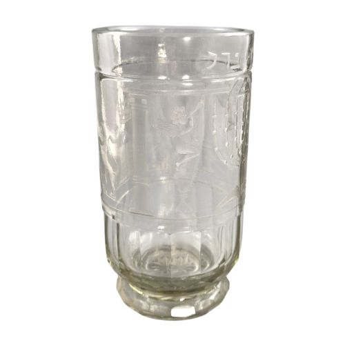 fig 2. A large clear glass beaker featuring detailed wheel-engraved ceremonial iconography, vertical fluted panels near the lower rim, and a faceted base.