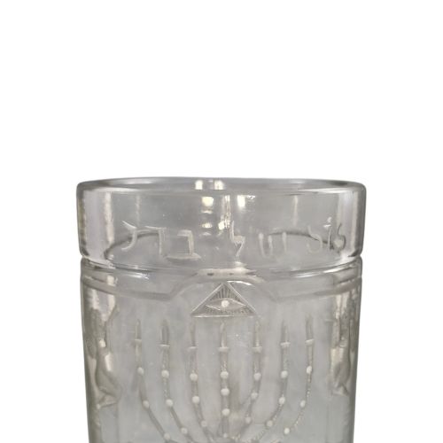 fig 3. A large clear glass beaker featuring detailed wheel-engraved ceremonial iconography, vertical fluted panels near the lower rim, and a faceted base.