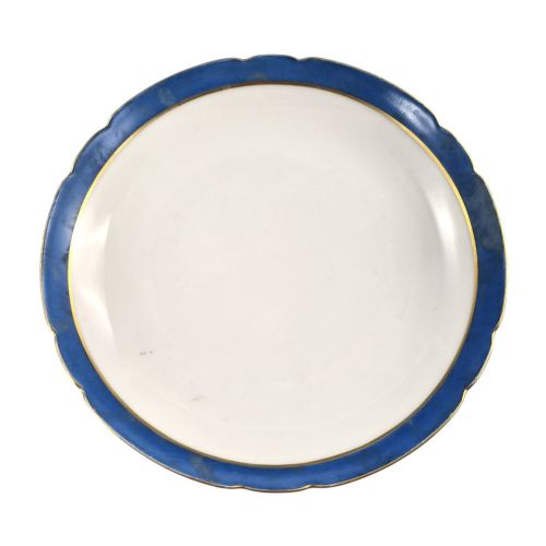 fig 3. A cobalt blue and gilt porcelain tazza elevated on a pedestal base, adorned with a hand-painted winter landscape cartouche.