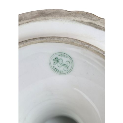 fig 4. A cobalt blue and gilt porcelain tazza elevated on a pedestal base, adorned with a hand-painted winter landscape cartouche.