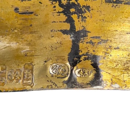fig 1. A rectangular antique Orthodox silver icon featuring repousse depictions of the Three Holy Hierarchs with detailed halos and Cyrillic script along the bottom edge.