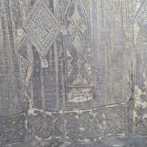 fig 7. A rectangular antique Orthodox silver icon featuring repousse depictions of the Three Holy Hierarchs with detailed halos and Cyrillic script along the bottom edge.