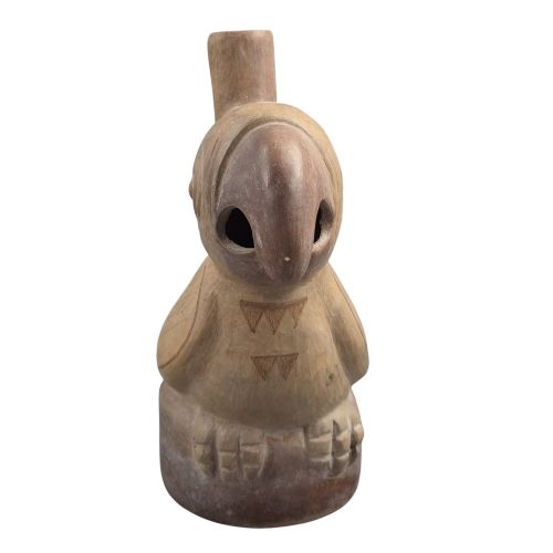 fig 5. A beige terracotta Pre-Columbian stirrup spout vessel sculpted in the shape of a perched bird.