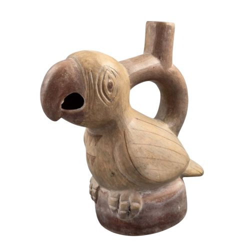 fig 6. A beige terracotta Pre-Columbian stirrup spout vessel sculpted in the shape of a perched bird.