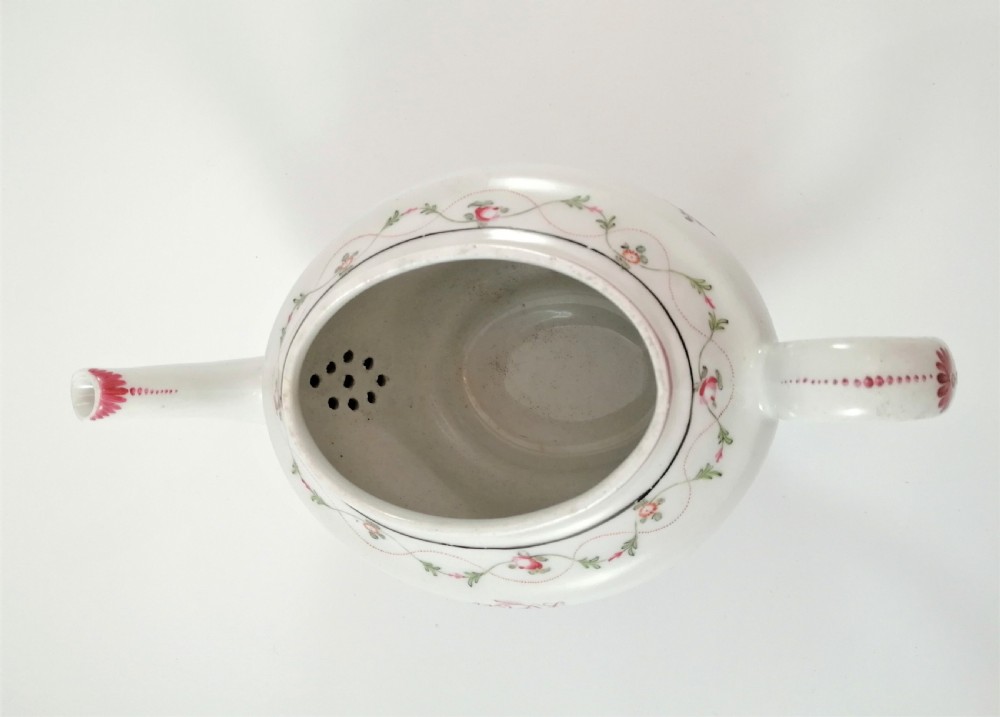 A hard paste porcelain New Hall teapot of oval shape,c.1800 View X