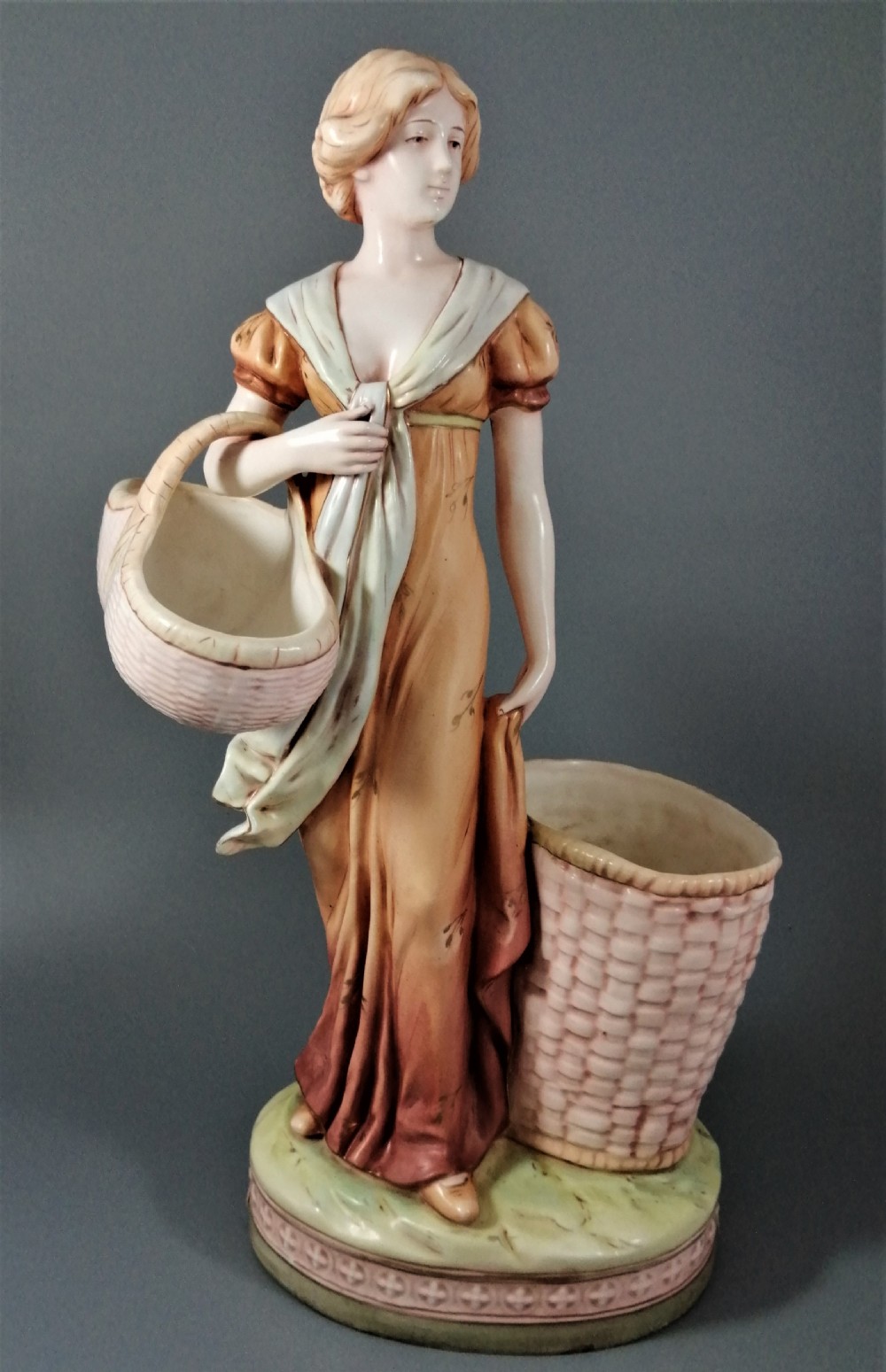 Antique Royal Dux figurine of a woman with wicker baskets View IX