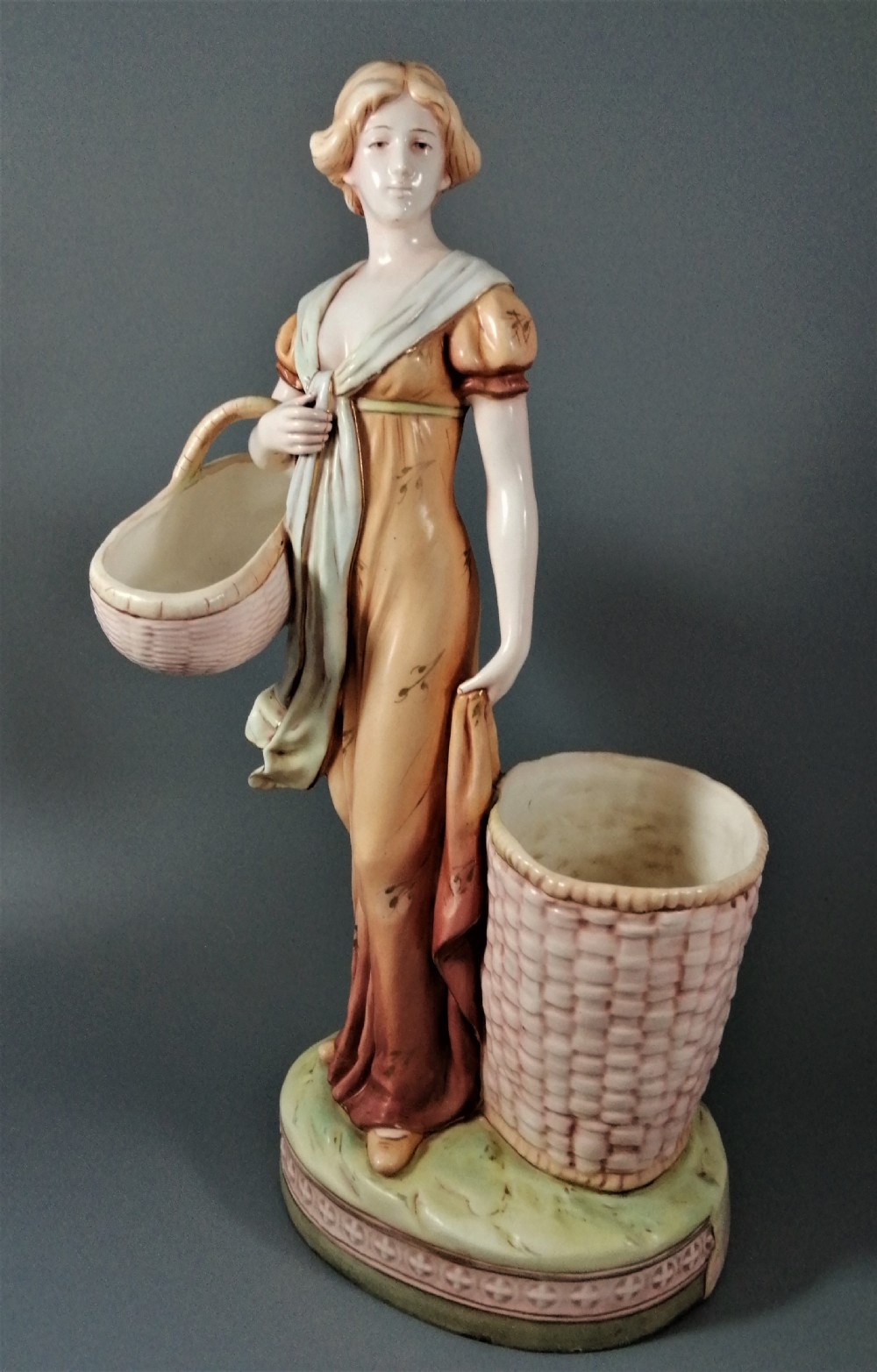 Antique Royal Dux figurine of a woman with wicker baskets View X