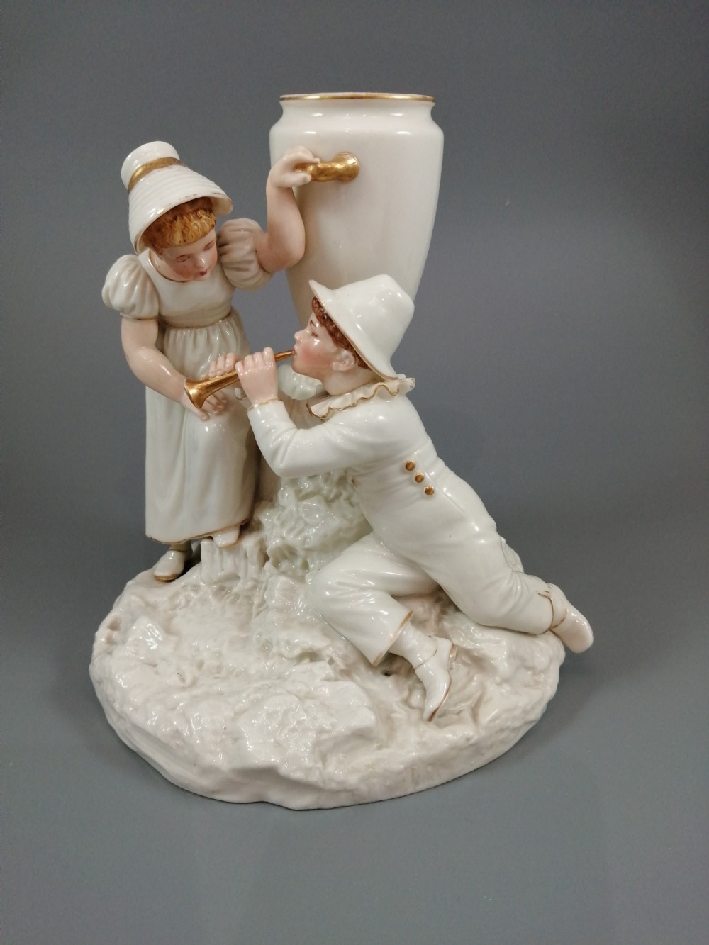 Royal Worcester group: boy with horn and girl . James Hadley, 1881. View II