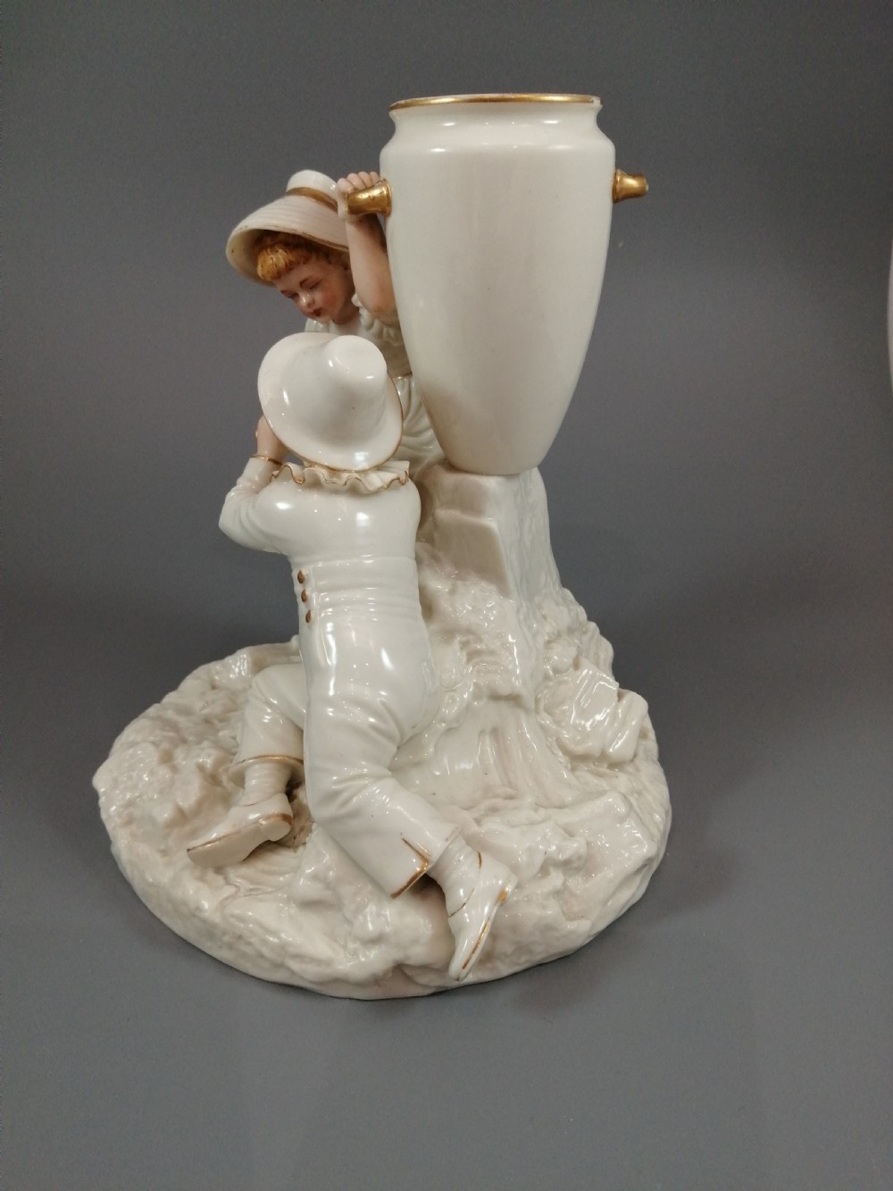 Royal Worcester group: boy with horn and girl . James Hadley, 1881. View IV