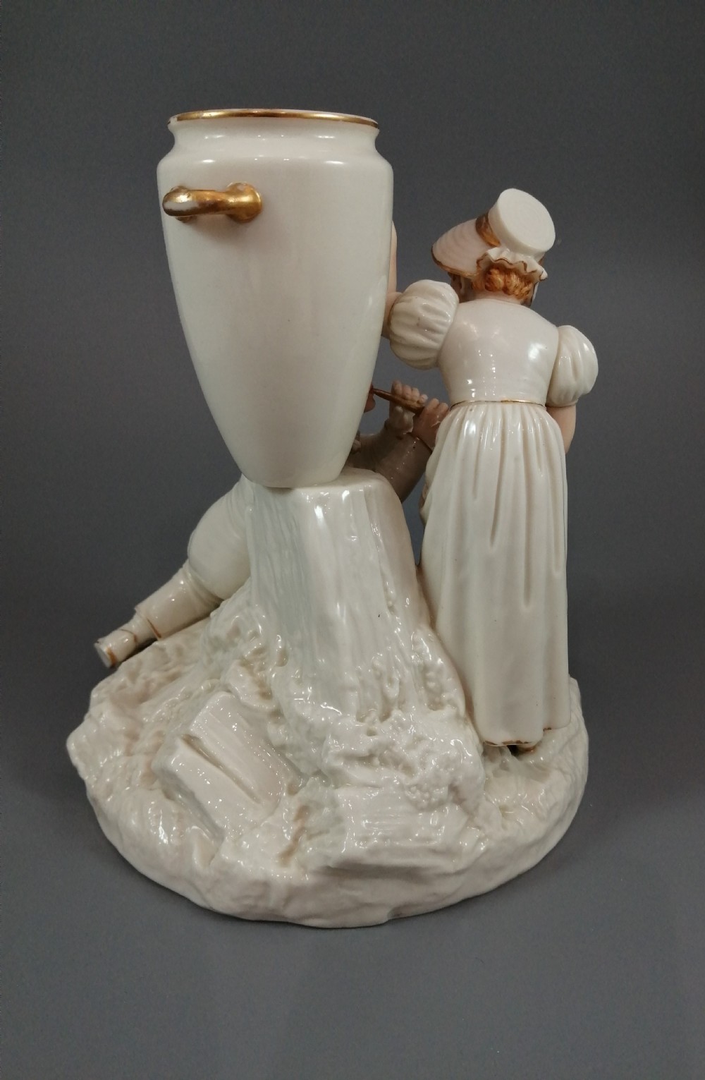 Royal Worcester group: boy with horn and girl . James Hadley, 1881. View VII