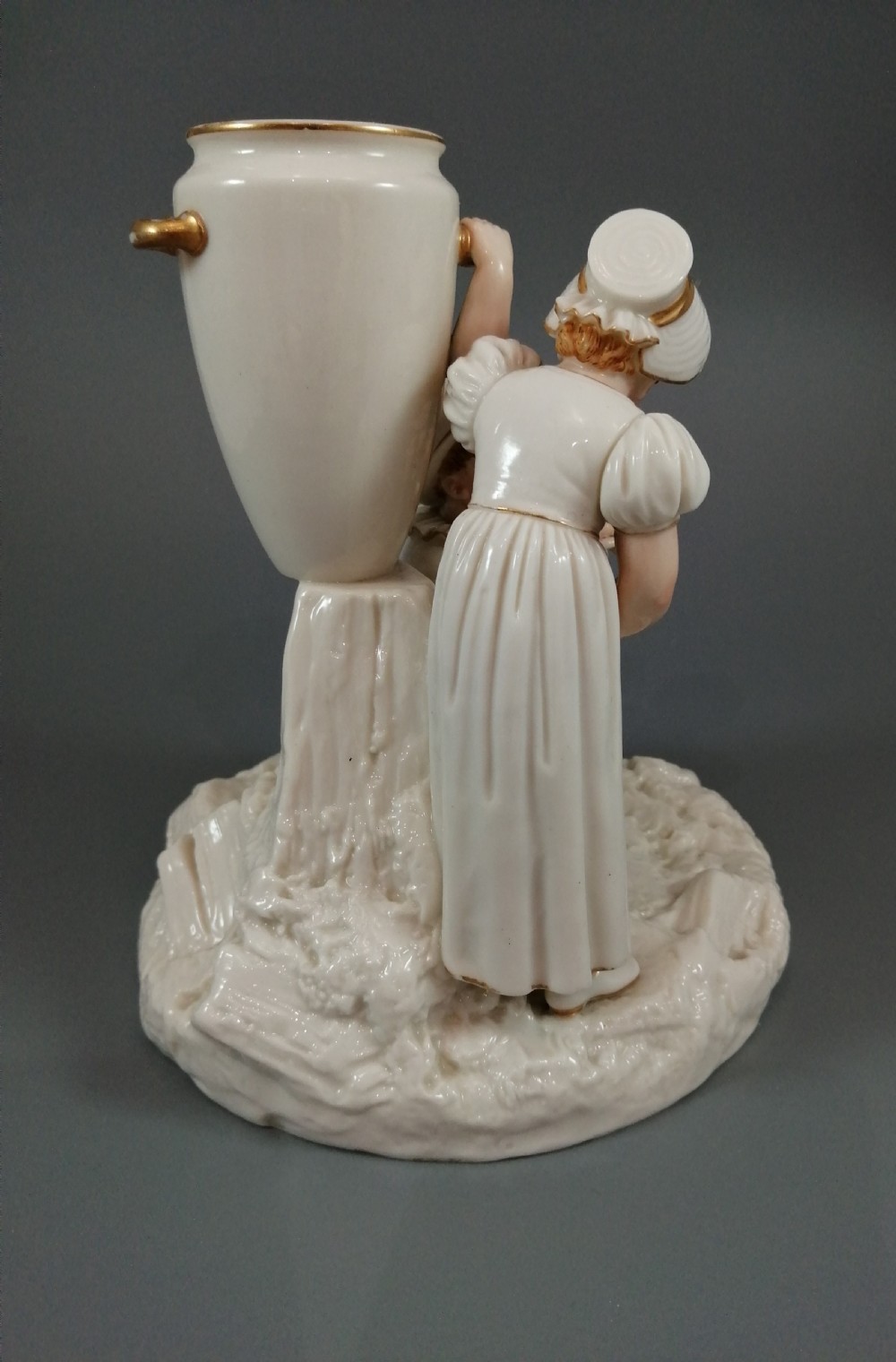 Royal Worcester group: boy with horn and girl . James Hadley, 1881. View VIII