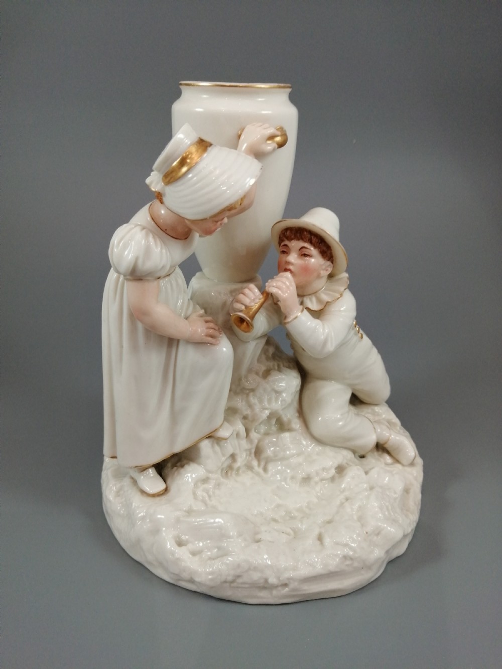 Royal Worcester group: boy with horn and girl . James Hadley, 1881. View XI