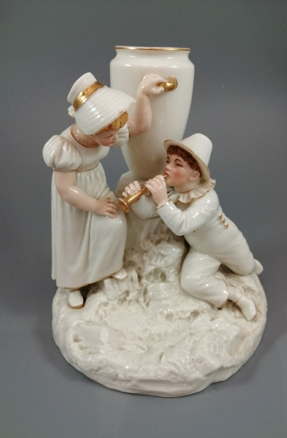 Royal Worcester group: boy with horn and girl . James Hadley, 1881. View XII