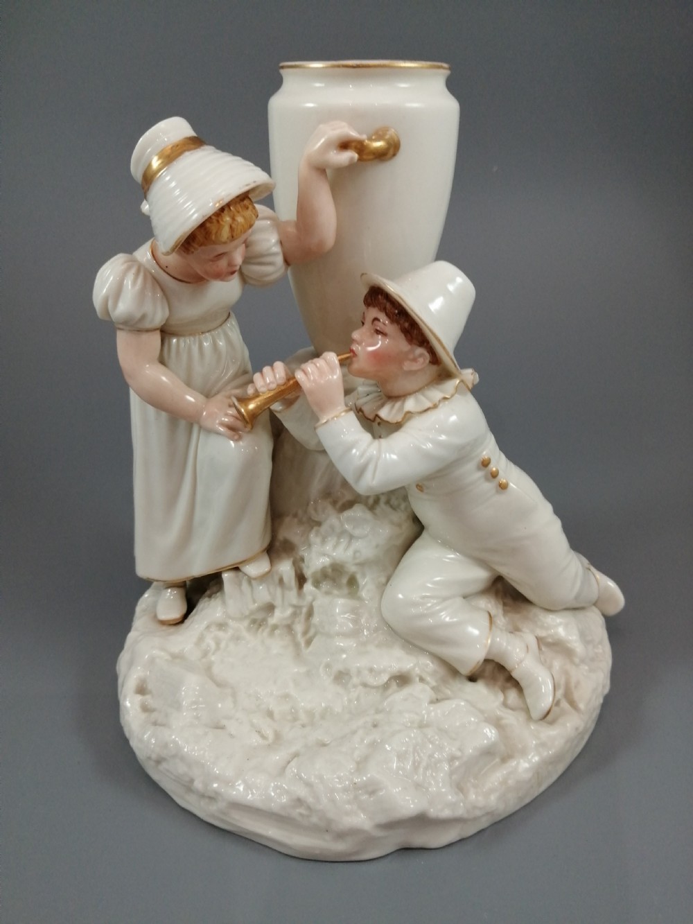 Royal Worcester group: boy with horn and girl . James Hadley, 1881. View XIII
