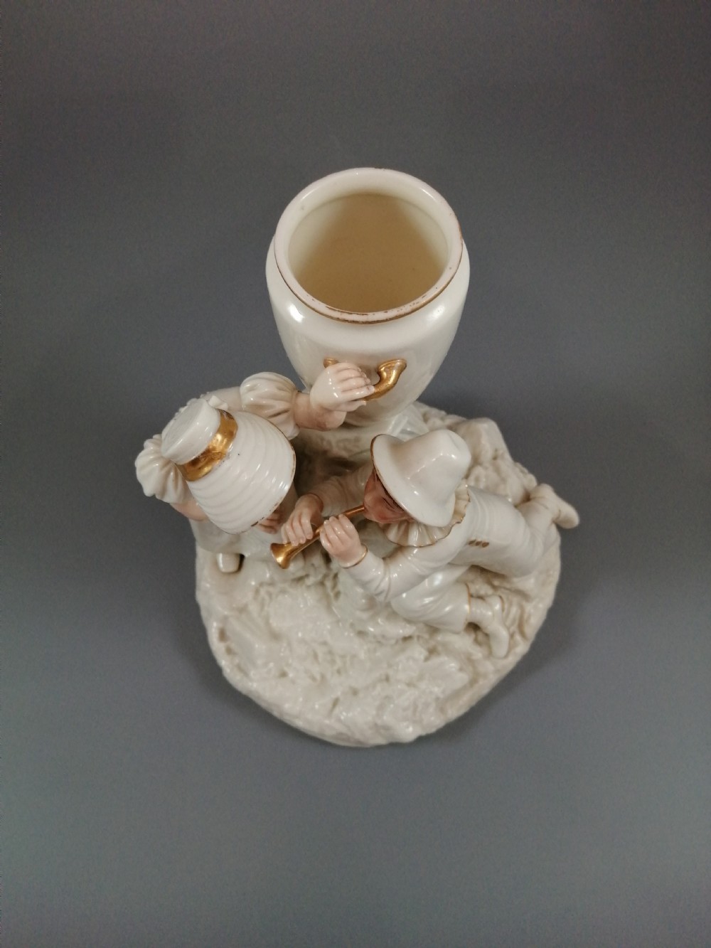Royal Worcester group: boy with horn and girl . James Hadley, 1881. View XIV