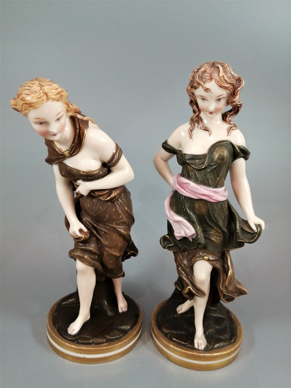 A pair of nineteenth-century Royal Worcester porcelain figurines depicting draped female figures with windblown hair and garments. View II