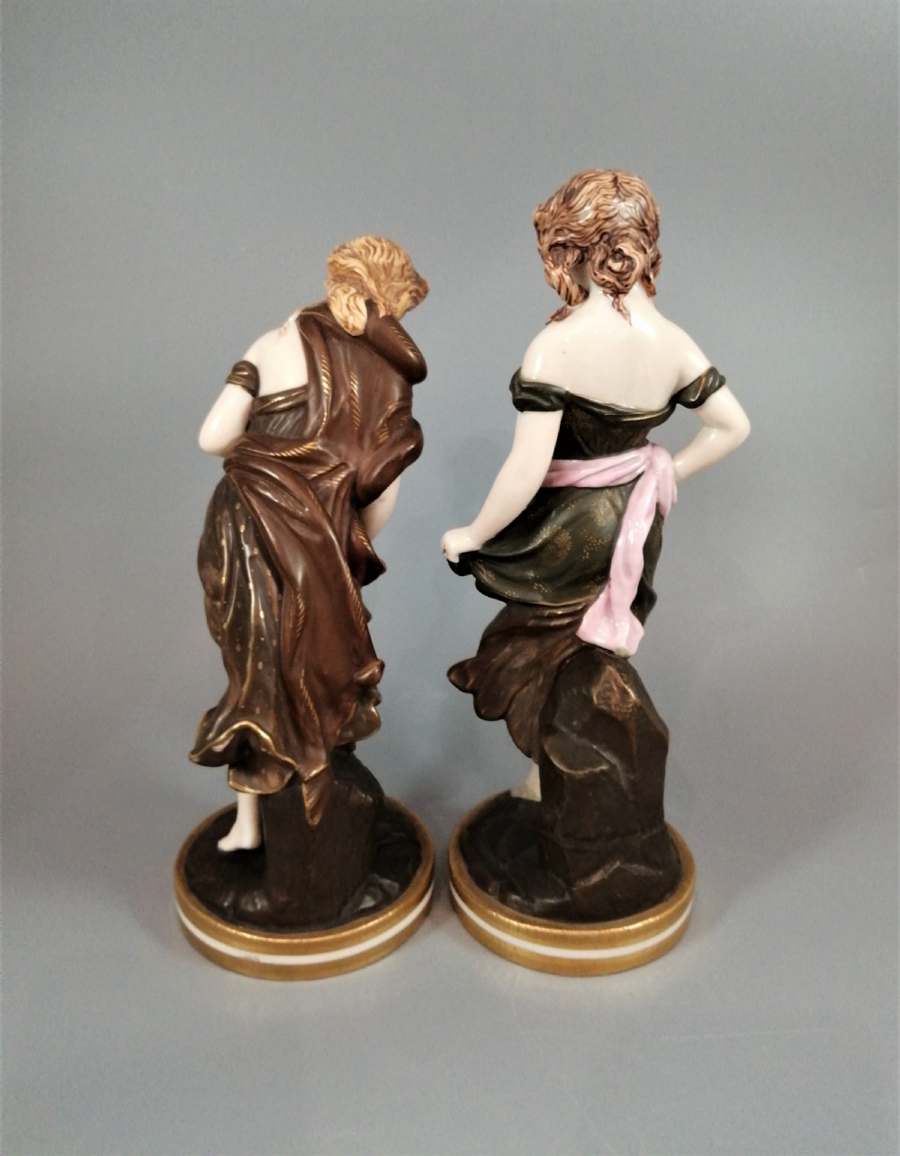 A pair of nineteenth-century Royal Worcester porcelain figurines depicting draped female figures with windblown hair and garments. View V