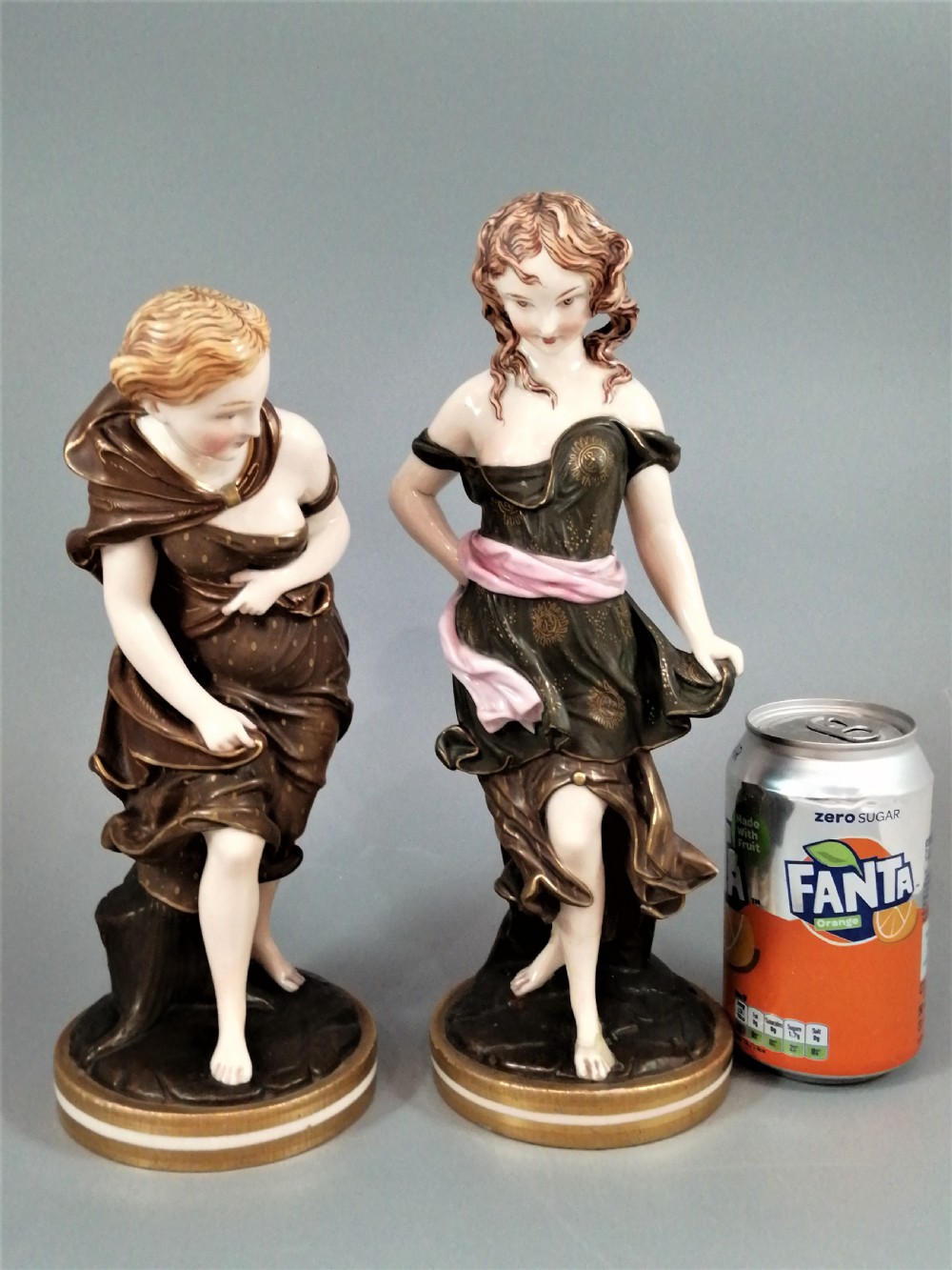 A pair of nineteenth-century Royal Worcester porcelain figurines depicting draped female figures with windblown hair and garments. View VII
