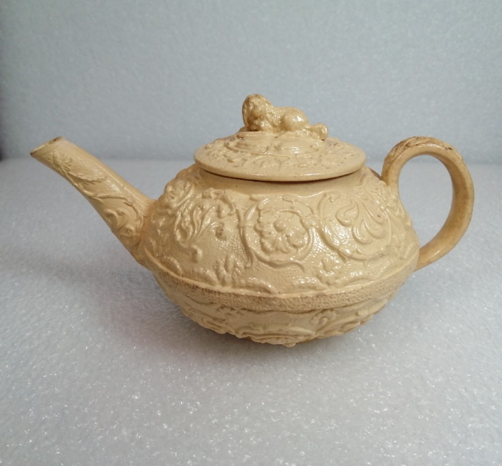 A small caneware teapot with a spaniel finial. Wedgwood, C.1800