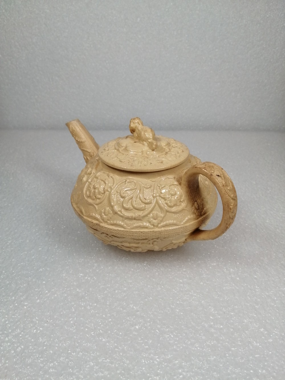 A small caneware teapot with a spaniel finial. Wedgwood, C.1800 View III