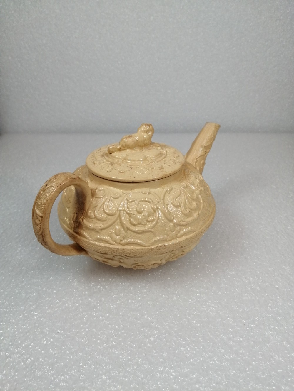 A small caneware teapot with a spaniel finial. Wedgwood, C.1800 View IV