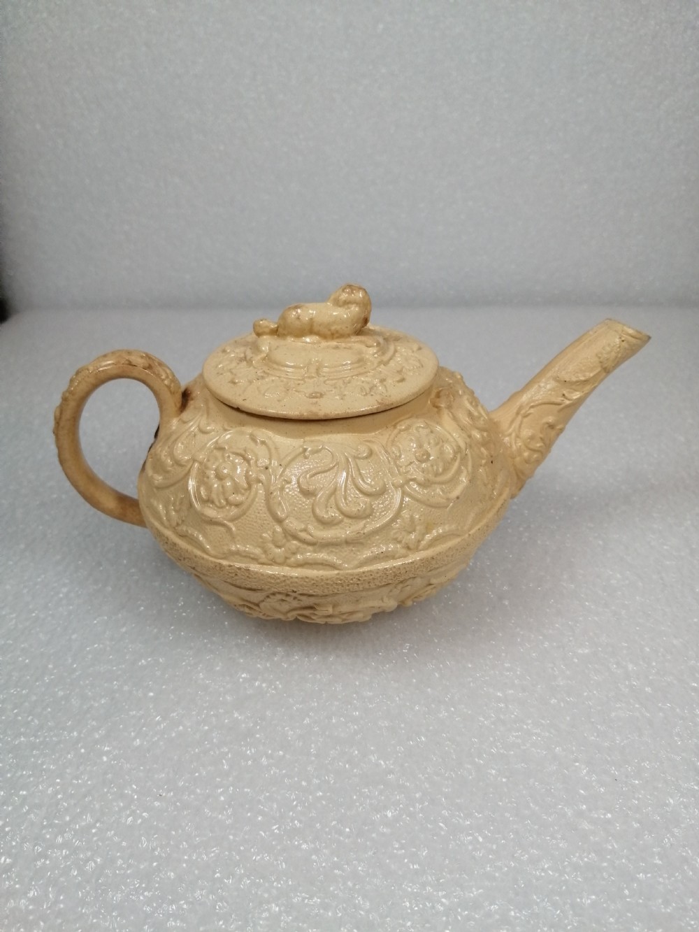 A small caneware teapot with a spaniel finial. Wedgwood, C.1800 View VI