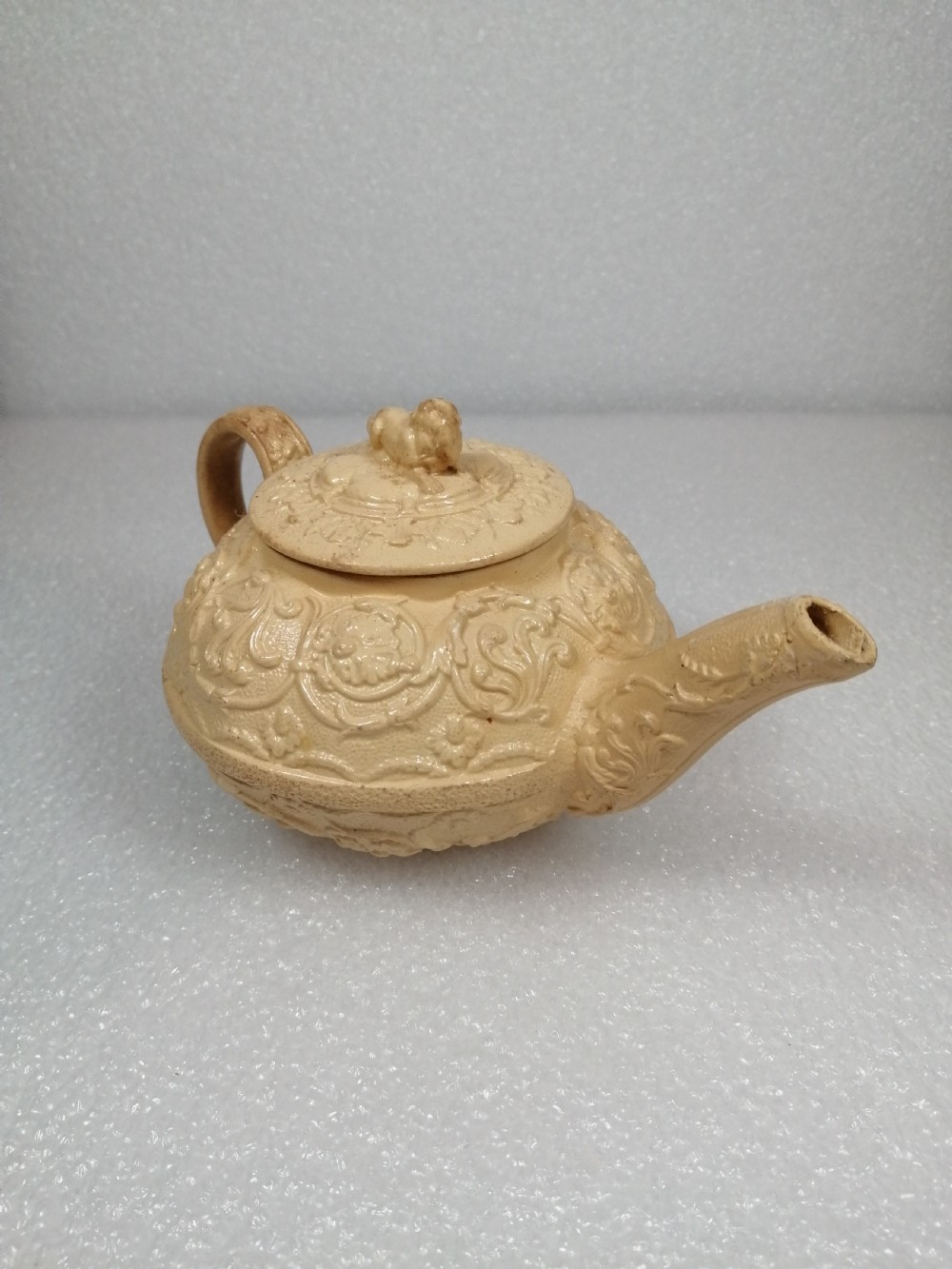 A small caneware teapot with a spaniel finial. Wedgwood, C.1800 View VIII