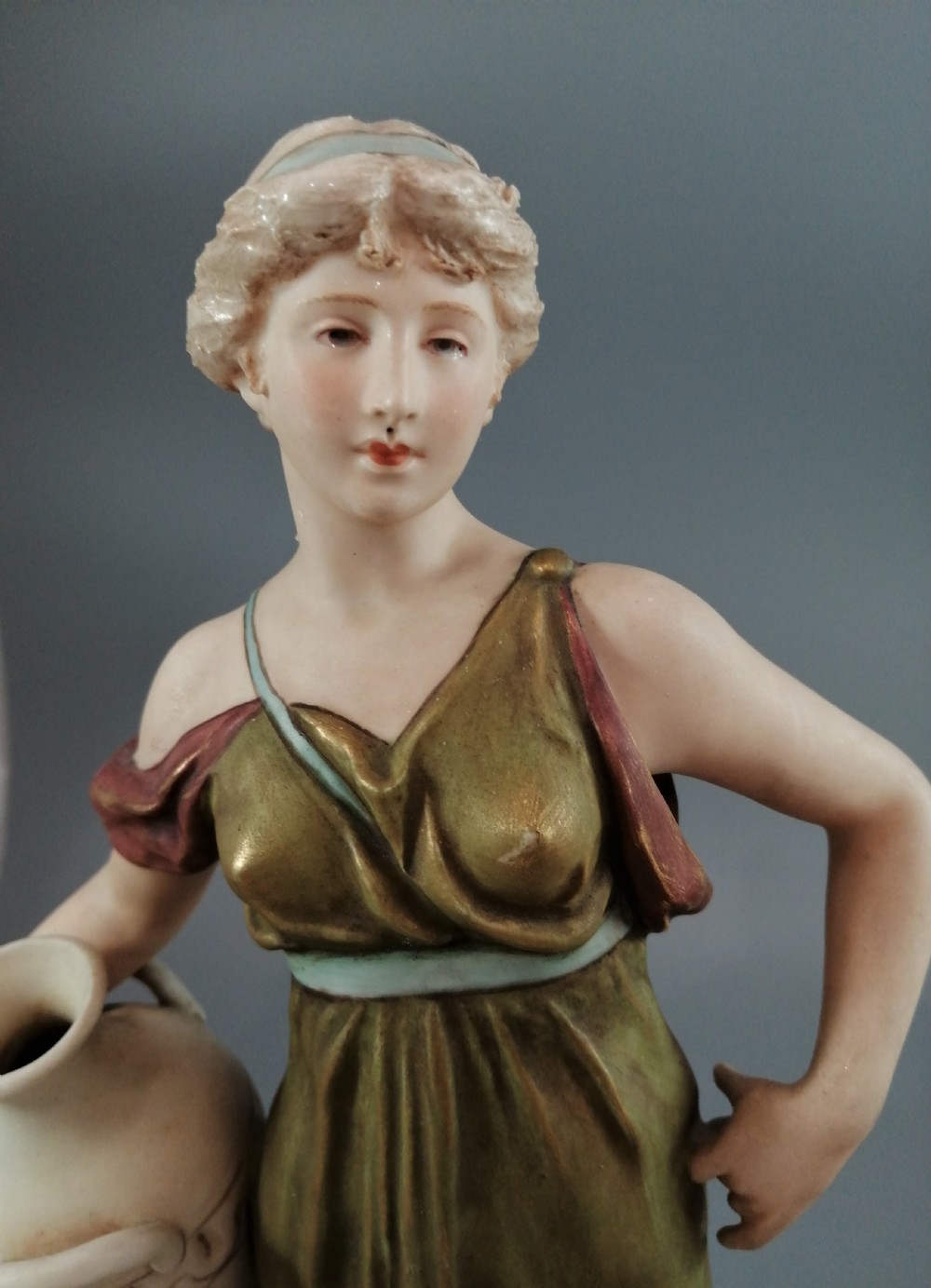 Beautiful antique Royal Dux porcelain figurine depicting a lady holding a jug. View IX