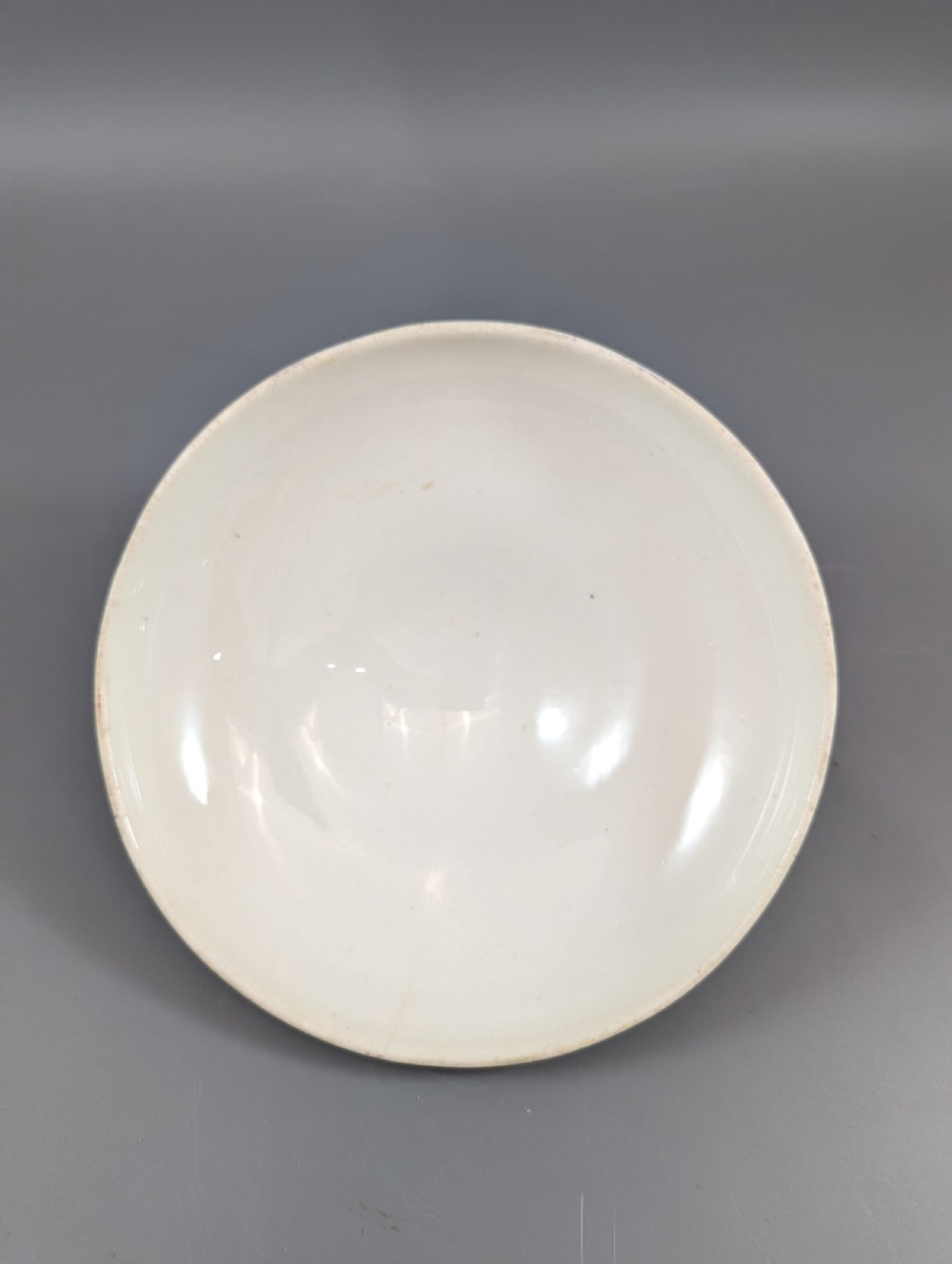 A circular antique porcelain butter dish with stand, decorated with hand-painted Japanese Kakiemon style quail and floral motifs in iron-red, blue, and gold. View VII