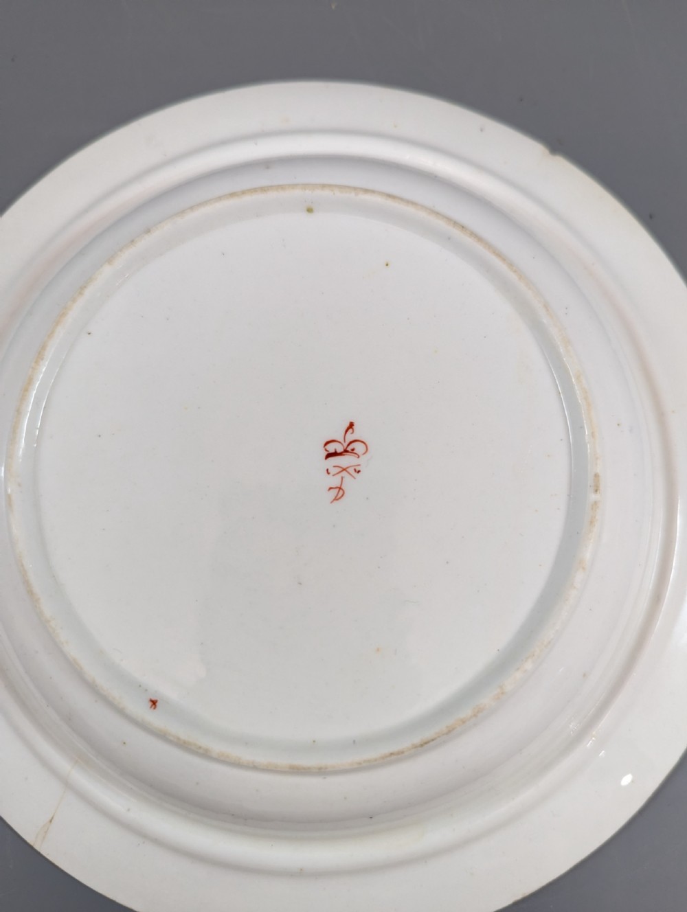 A circular antique porcelain butter dish with stand, decorated with hand-painted Japanese Kakiemon style quail and floral motifs in iron-red, blue, and gold. View XI