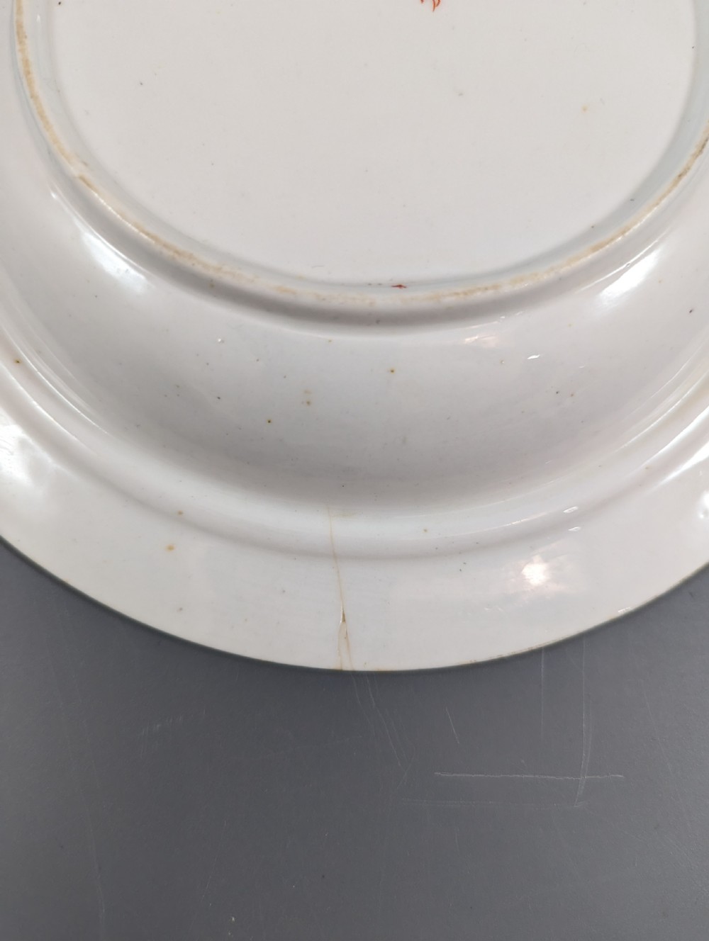 A circular antique porcelain butter dish with stand, decorated with hand-painted Japanese Kakiemon style quail and floral motifs in iron-red, blue, and gold. View XII