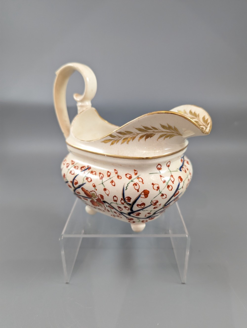 An antique cream-coloured porcelain jug featuring a hand-painted Two Quails design with gilded rim detailing and a raised loop handle. View VI