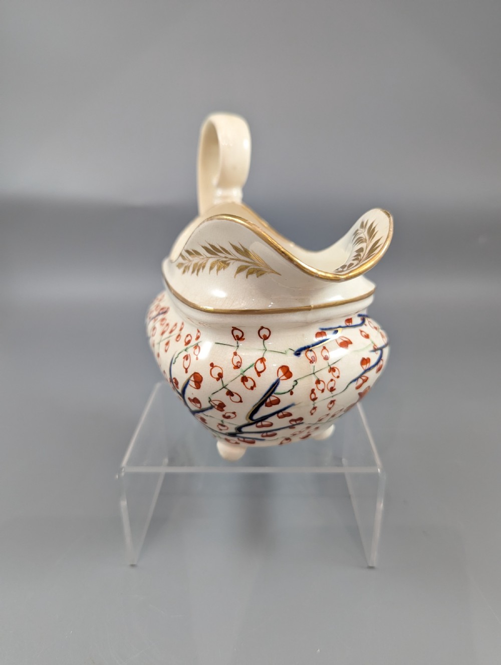 An antique cream-coloured porcelain jug featuring a hand-painted Two Quails design with gilded rim detailing and a raised loop handle. View VII