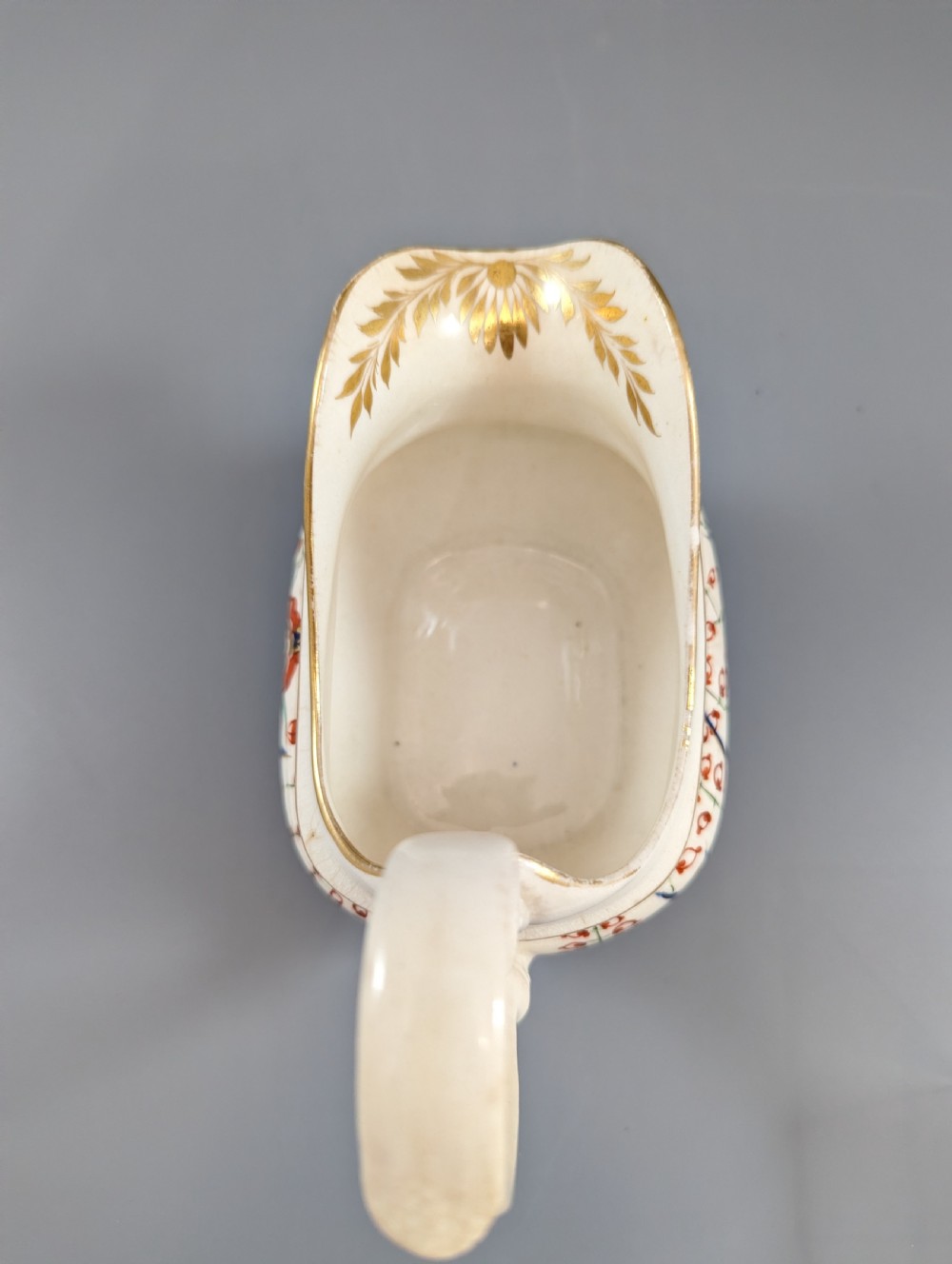 An antique cream-coloured porcelain jug featuring a hand-painted Two Quails design with gilded rim detailing and a raised loop handle. View IX