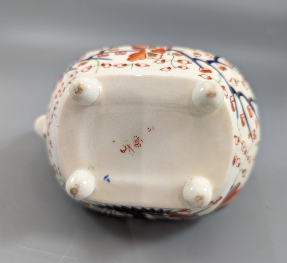 An antique cream-coloured porcelain jug featuring a hand-painted Two Quails design with gilded rim detailing and a raised loop handle. View XI